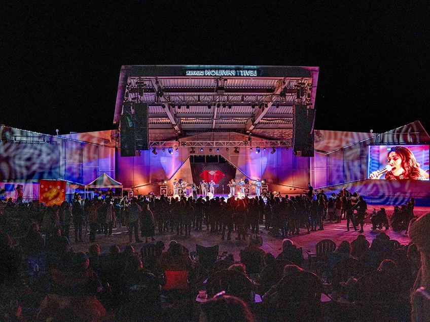 Levitt Pavilion at night with mariachi group on stage